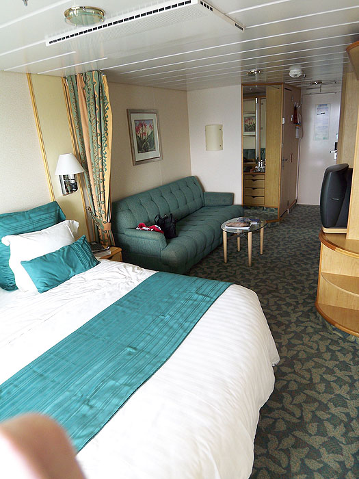 Our  Superior Oceanview Stateroom (deck 10, Rm 1674) with sleepsofa, private balcony, sitting area and private bathroom.