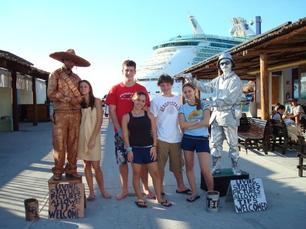 Kelly and shipmates pose with living statues after shopping on Cozumel.