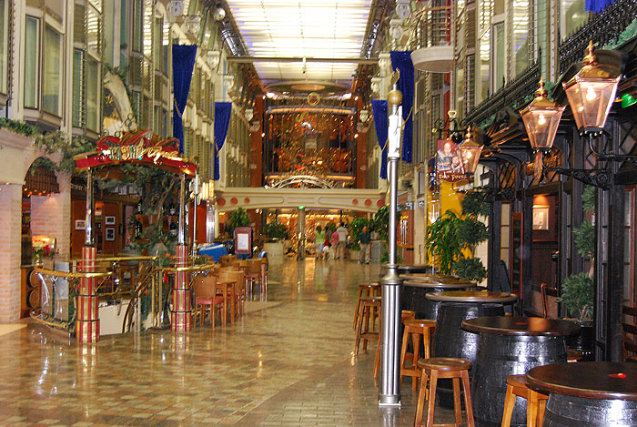 The Royal Promenade in the interior of the ship on deck 5 is a naturally lighted four-story area lined with bars and shops.