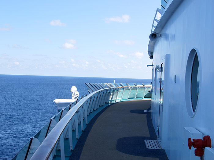 View from the front corner of the ship while at sea.
