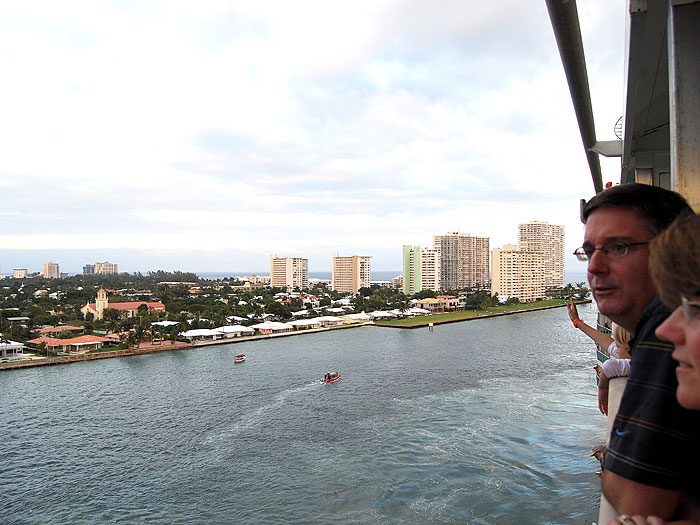 Dave and Anna enjoy the view from their deck-10 stateroom as the ship sets sail.