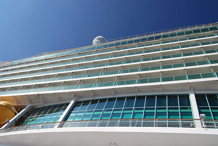 A vertical view up the side of the 15-deck Navigator of the Seas from the port in Cozumel, Mexico.